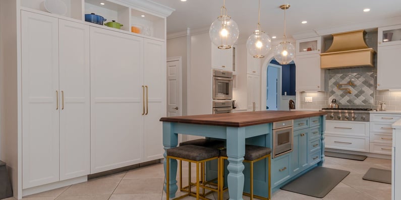 kitchen remodel on the east side of cleveland with blue kitchen island and appliances matching white cabinetry