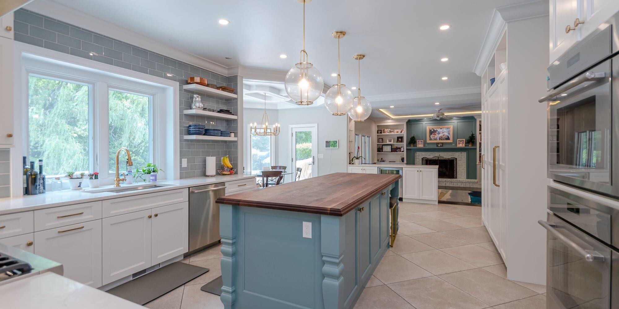 open concept kitchen and living area with blue kitchen island in cleveland ohio