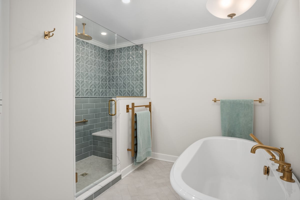luxury bathroom design with soaking tub and tiled walk-in shower by Chagrin River Company in Cleveland Heights, OH