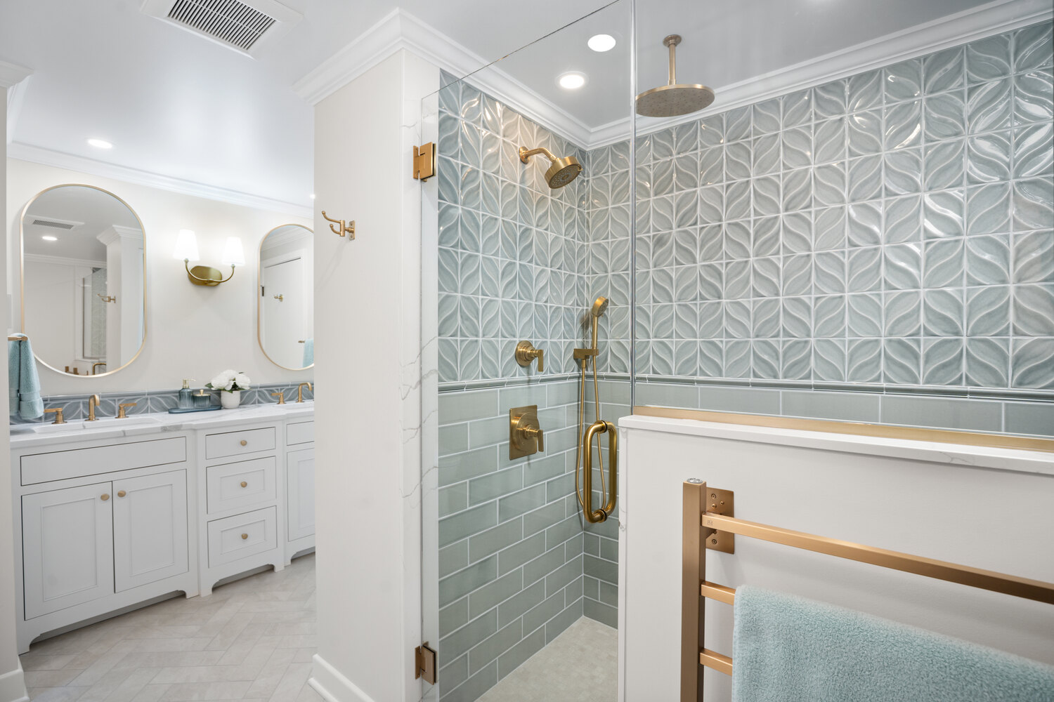 walk-in shower remodel with patterned tile and gold fixtures by Chagrin River Company in Chagrin Falls, OH