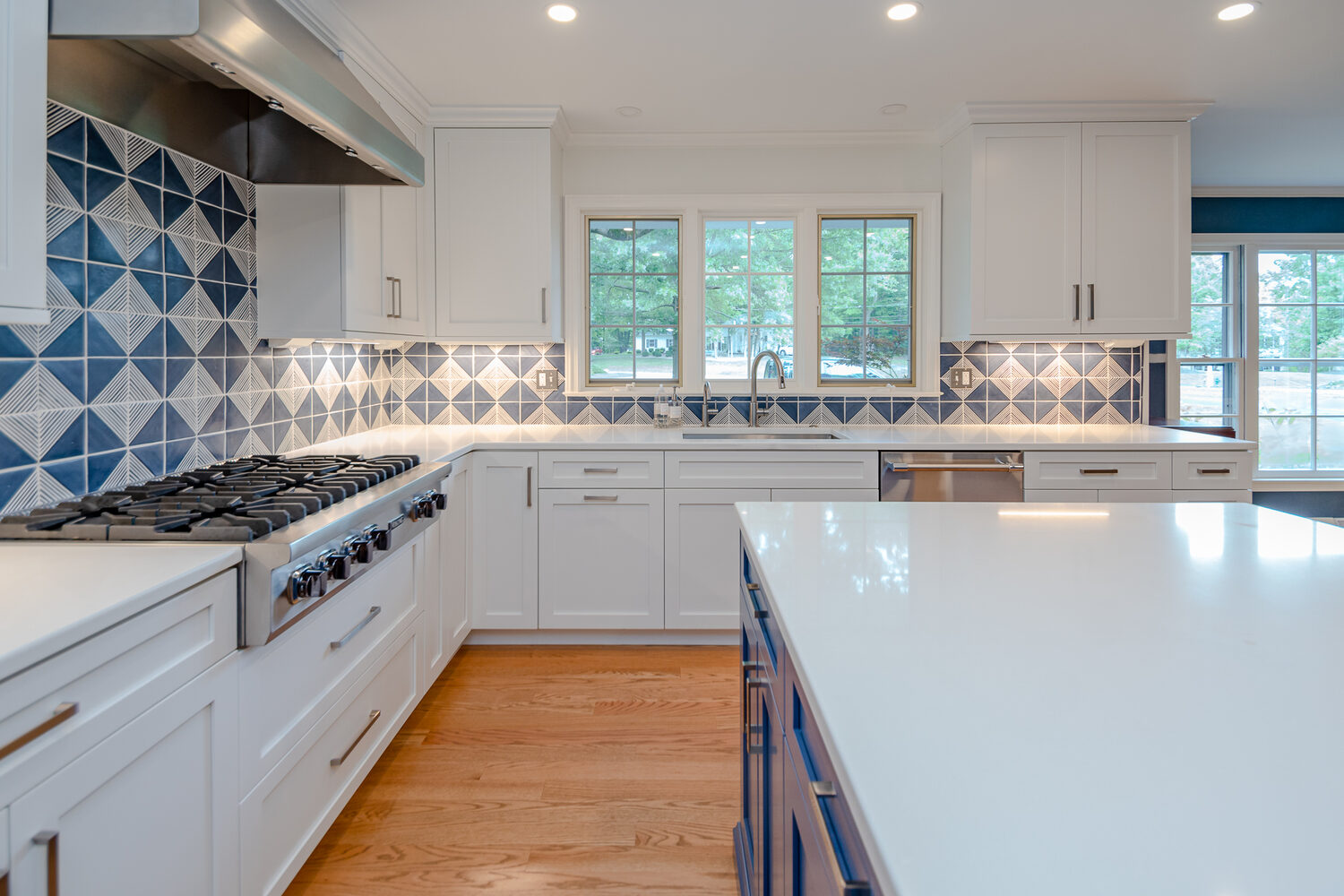 kitchen remodel with white cabinets and large window over sink by Chagrin River Company in Bainbridge, OH