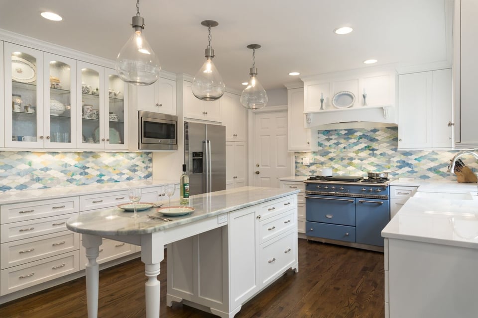 kitchen island with marble countertop and pendant lighting by Chagrin River Company in Pepper Pike, OH