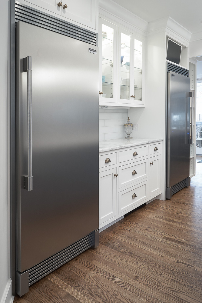 kitchen renovation featuring built-in refrigerators and marble countertops by Chagrin River Company in Shaker Heights, OH