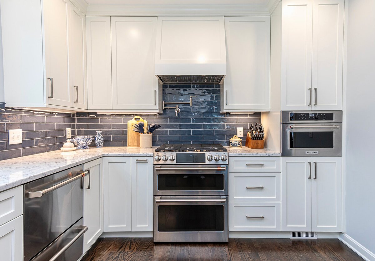 detailed view of custom home kitchen in Euclid, OH by Chagrin River Company showcasing stainless steel appliances and marble counters.