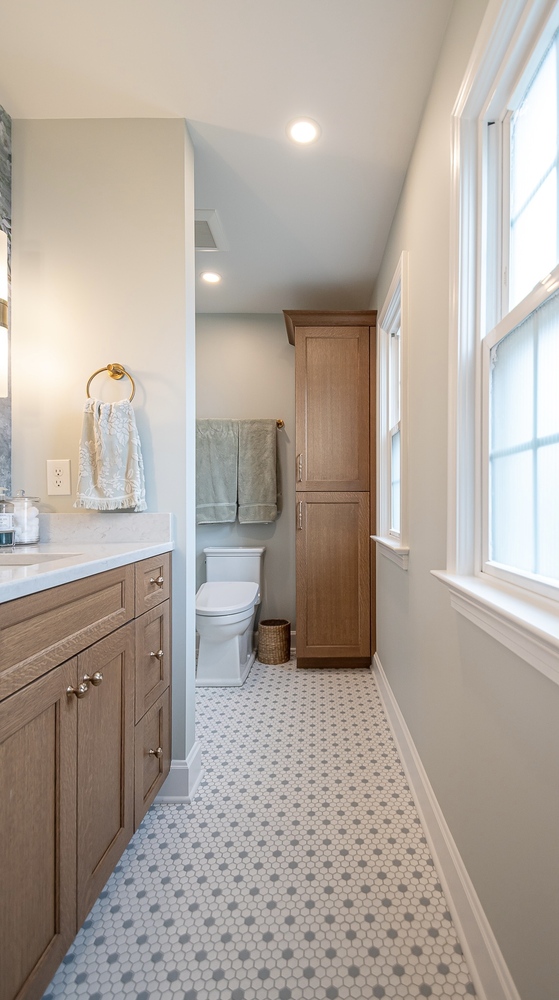 modern custom home bathroom layout by Chagrin River Company in Shaker Heights, OH with vanity and toilet area.