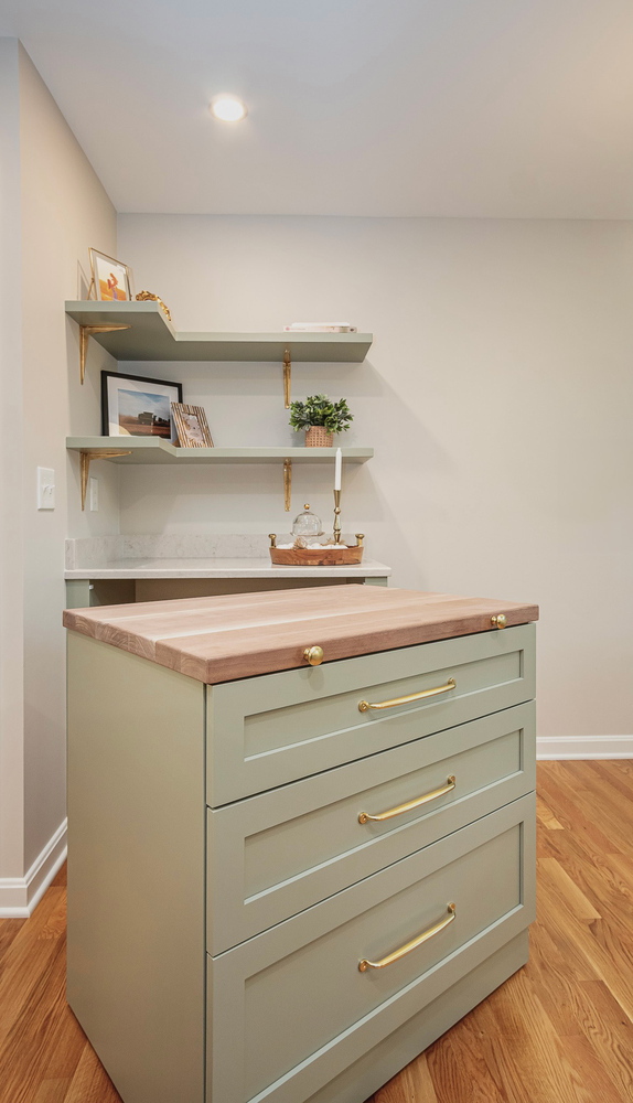 detailed custom home kitchen storage by Chagrin River Company in Shaker Heights, OH with marble backsplash and open shelving.