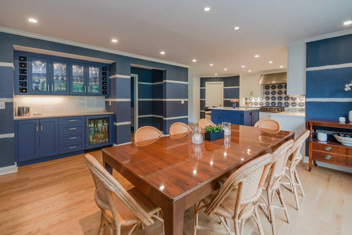 Pepper Pike, OH custom home kitchen and dining space by Chagrin River Company featuring built-in bar cabinetry.