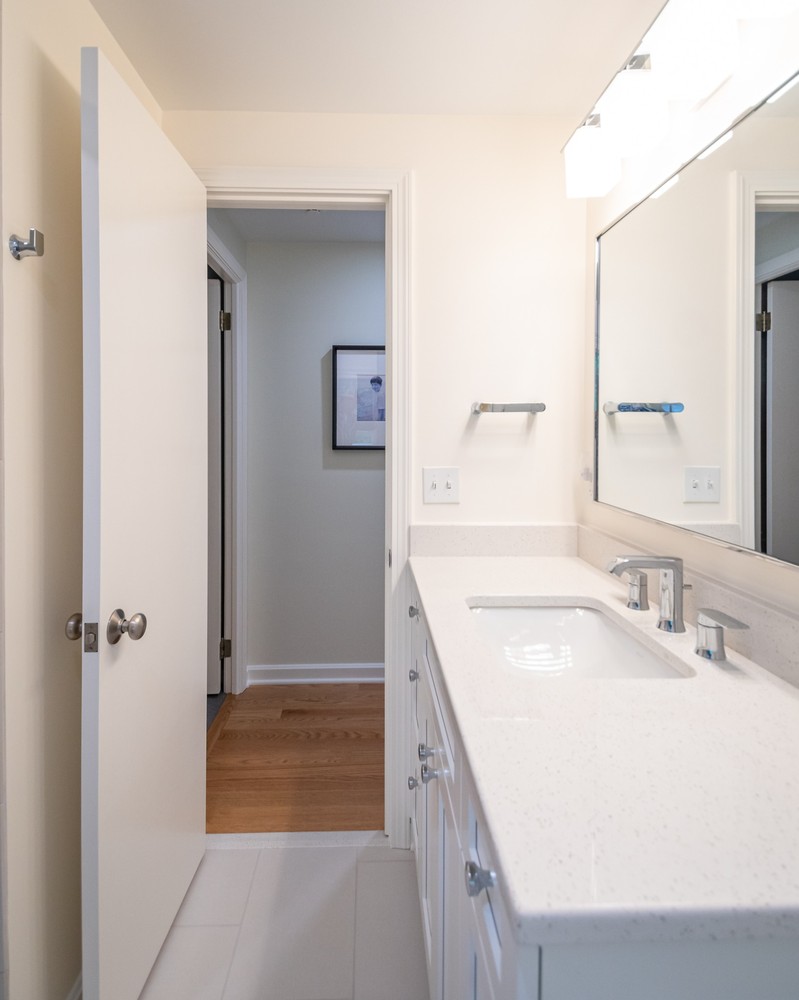 detailed custom home bathroom sink in Pepper Pike, OH by Chagrin River Company with recessed lighting and neutral palette.