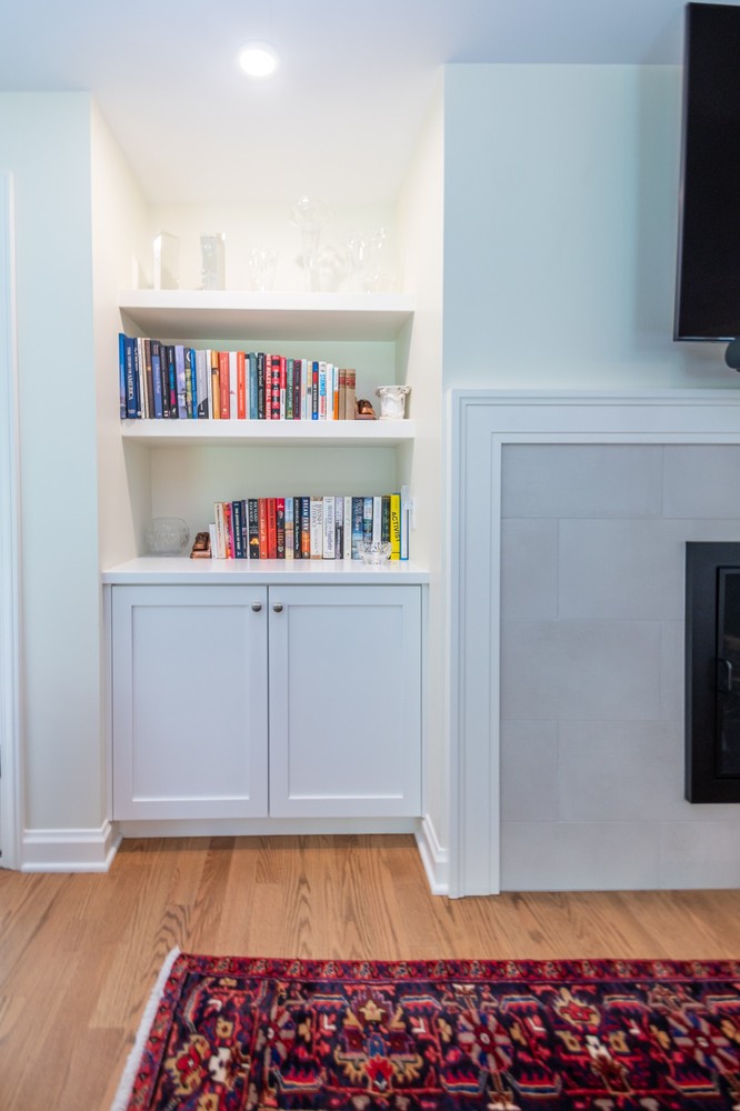 detailed custom home bookshelf design by Chagrin River Company in Pepper Pike, OH with integrated storage cabinets.