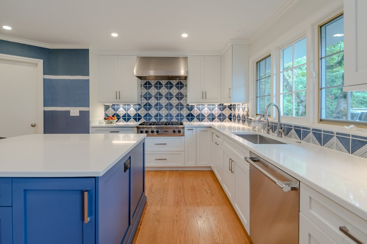 detailed custom home kitchen by Chagrin River Company in Pepper Pike, OH with white shaker cabinets and hardwood floors.