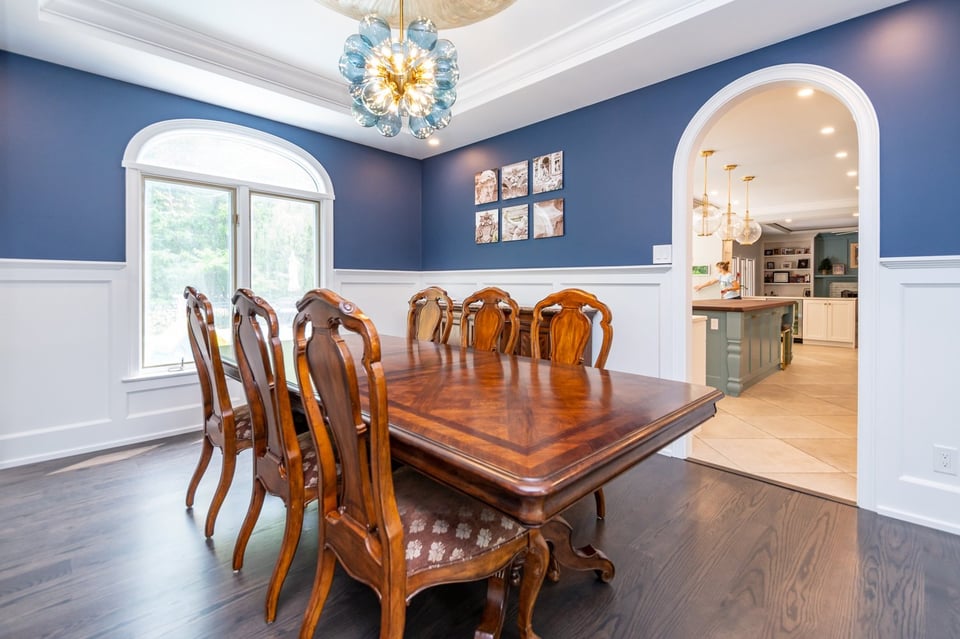 Solon, OH custom home formal dining room with wood buffet by Chagrin River Company