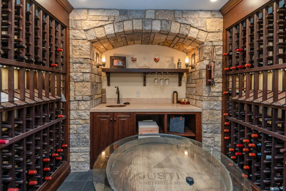 custom home wine cellar with wood cabinetry by Chagrin River Company in Solon, OH