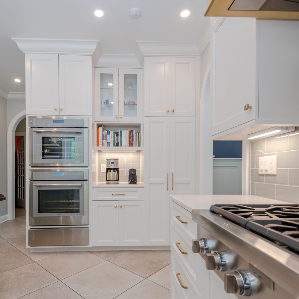 luxury custom home kitchen design with wall ovens by Chagrin River Company in Solon, OH