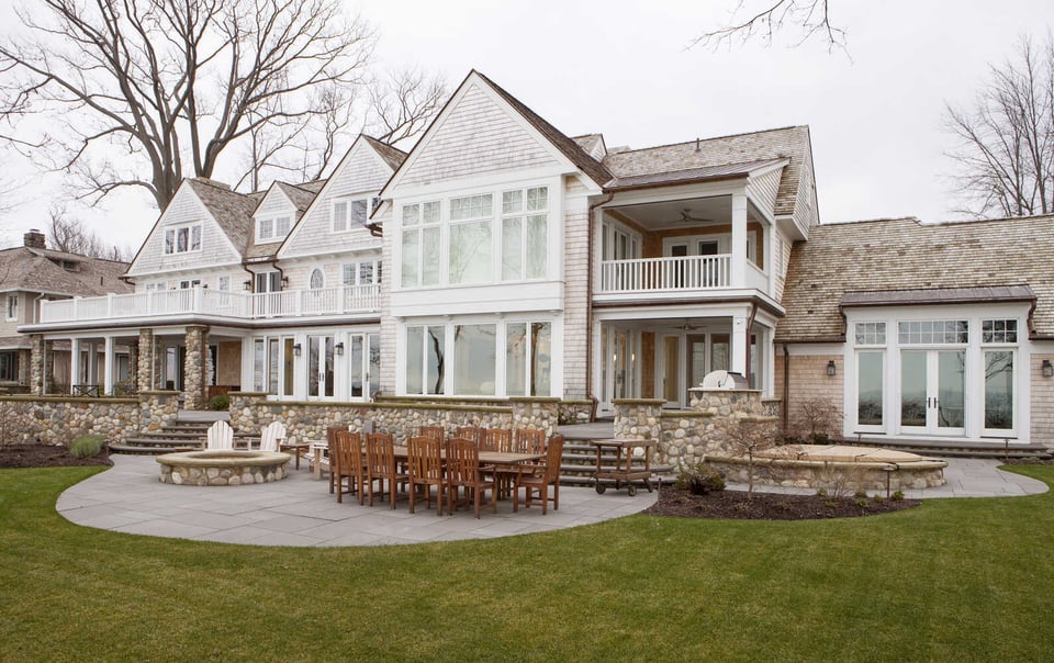custom home backyard patio and fire feature by Chagrin River Company in Chardon, Ohio