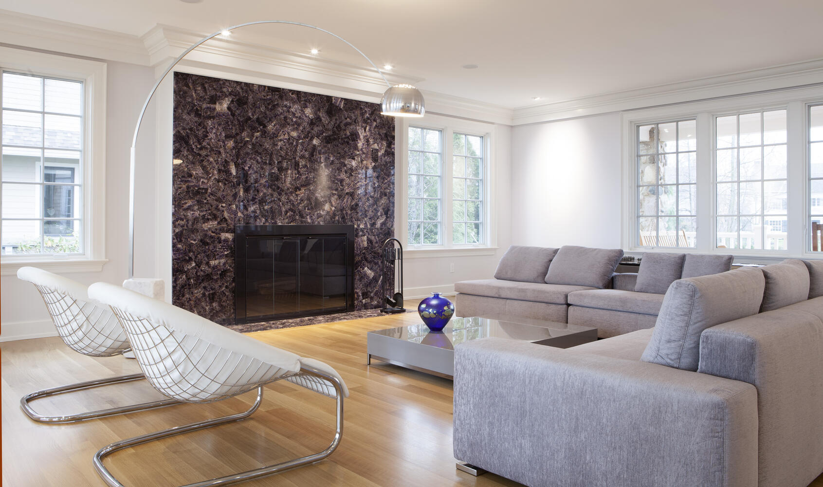 contemporary custom home great room with floor to ceiling fireplace by Chagrin River Company in Chardon, Ohio