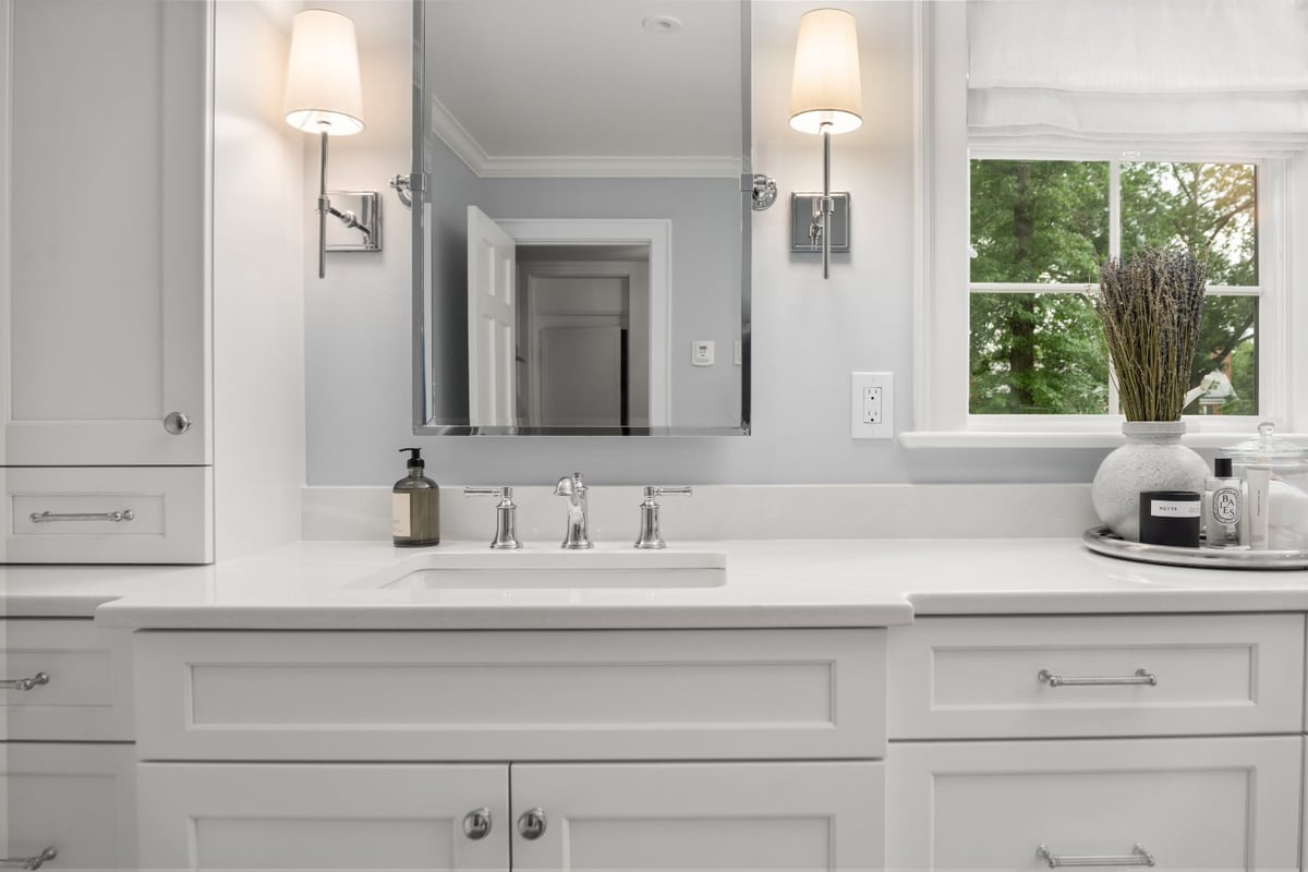 Chagrin River Company bathroom remodel in Shaker Heights featuring a custom white vanity, undermount sink, mirror, and chrome sc-optimized