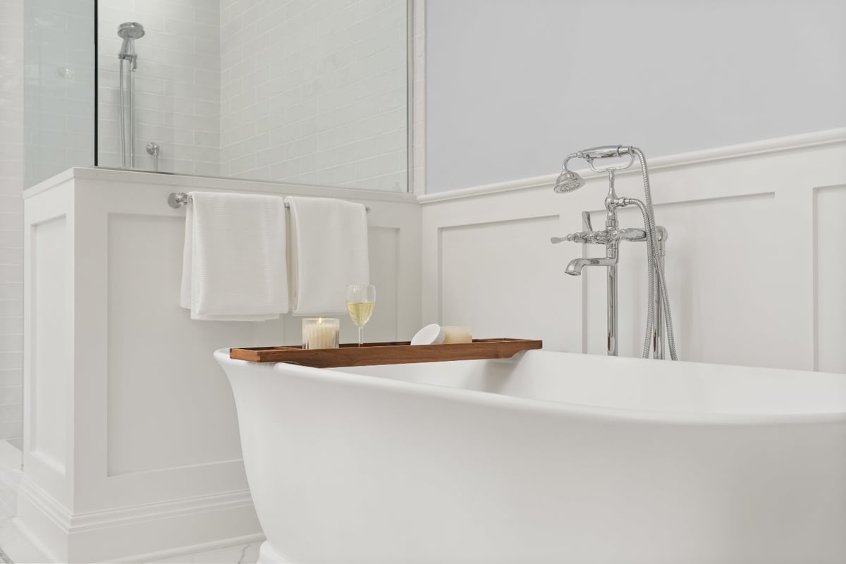 Chagrin River Company bathroom remodel in Shaker Heights featuring a freestanding tub, chrome floor-mounted faucet, and paneled -optimized