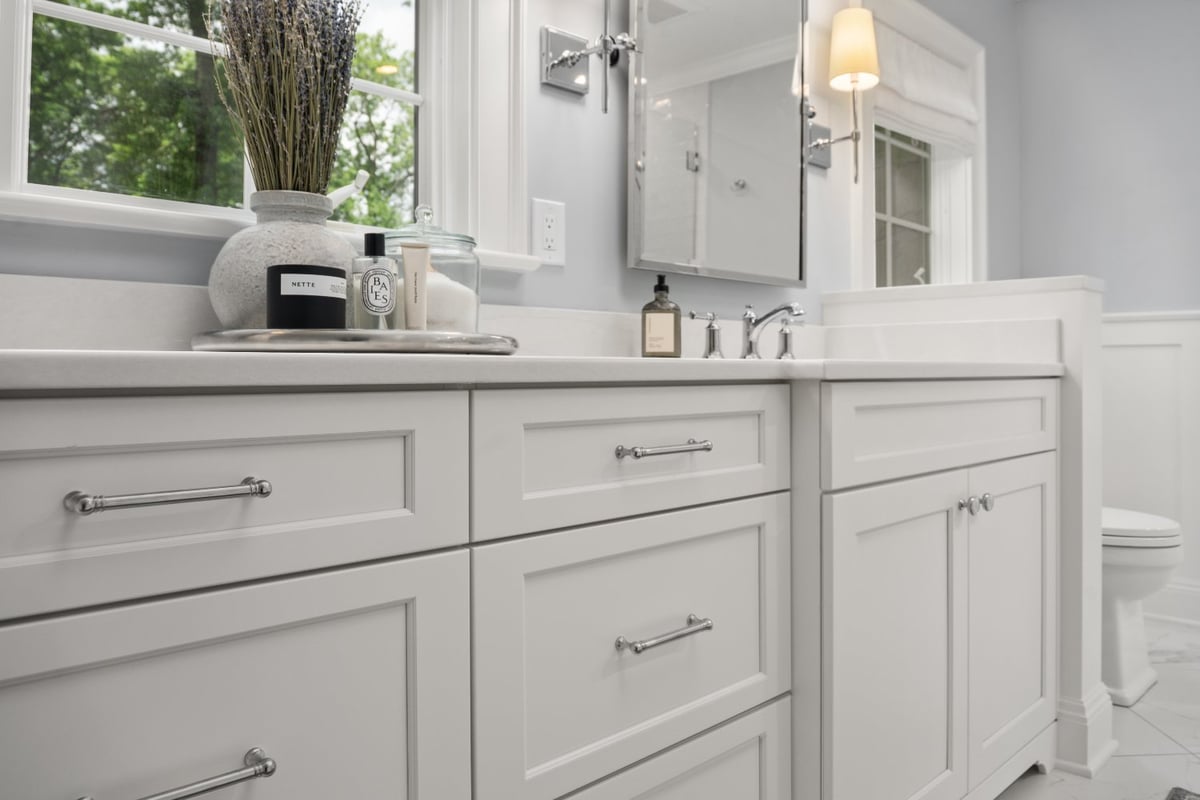 Chagrin River Company bathroom remodel in Shaker Heights featuring custom white vanity cabinetry, chrome hardware, and quartz-st-optimized