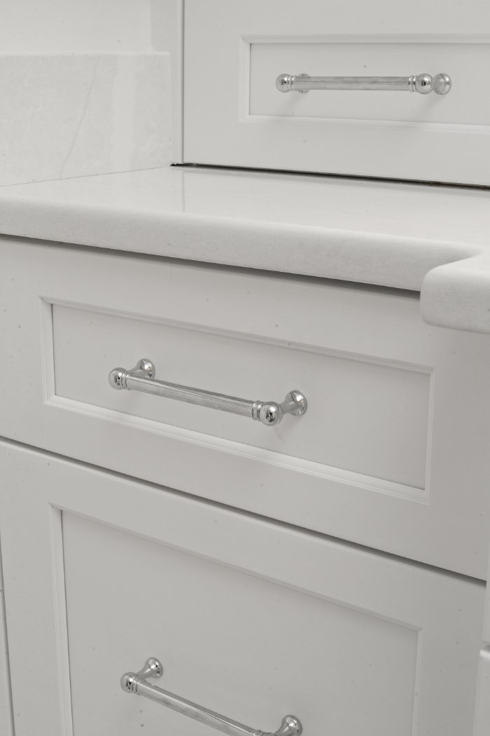 Chagrin River Company bathroom remodel in Shaker Heights featuring custom white vanity drawers, chrome pulls, and white countert-optimized