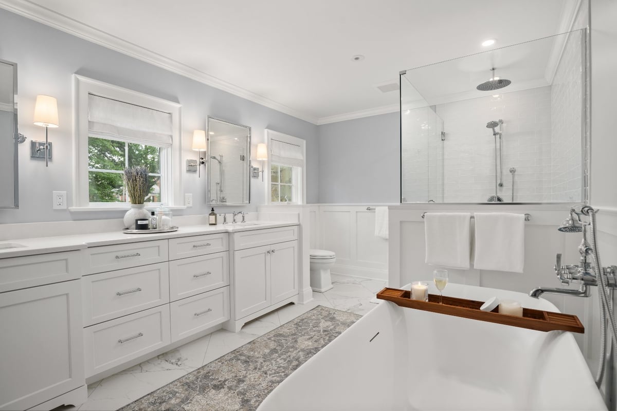 Chagrin River Company bathroom remodel in Shaker Heights with freestanding tub, glass shower, and double vanity.-optimized