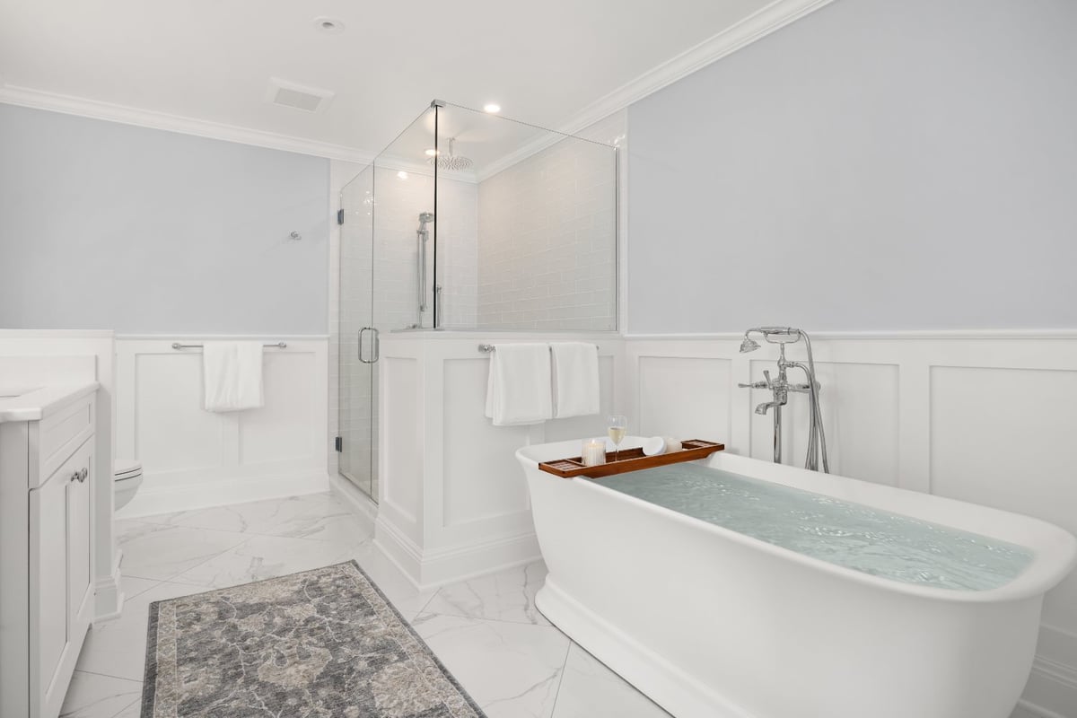 Shaker Heights bathroom remodel by Chagrin River Company with a freestanding soaking tub, chrome fixtures, glass shower, and mar-optimized