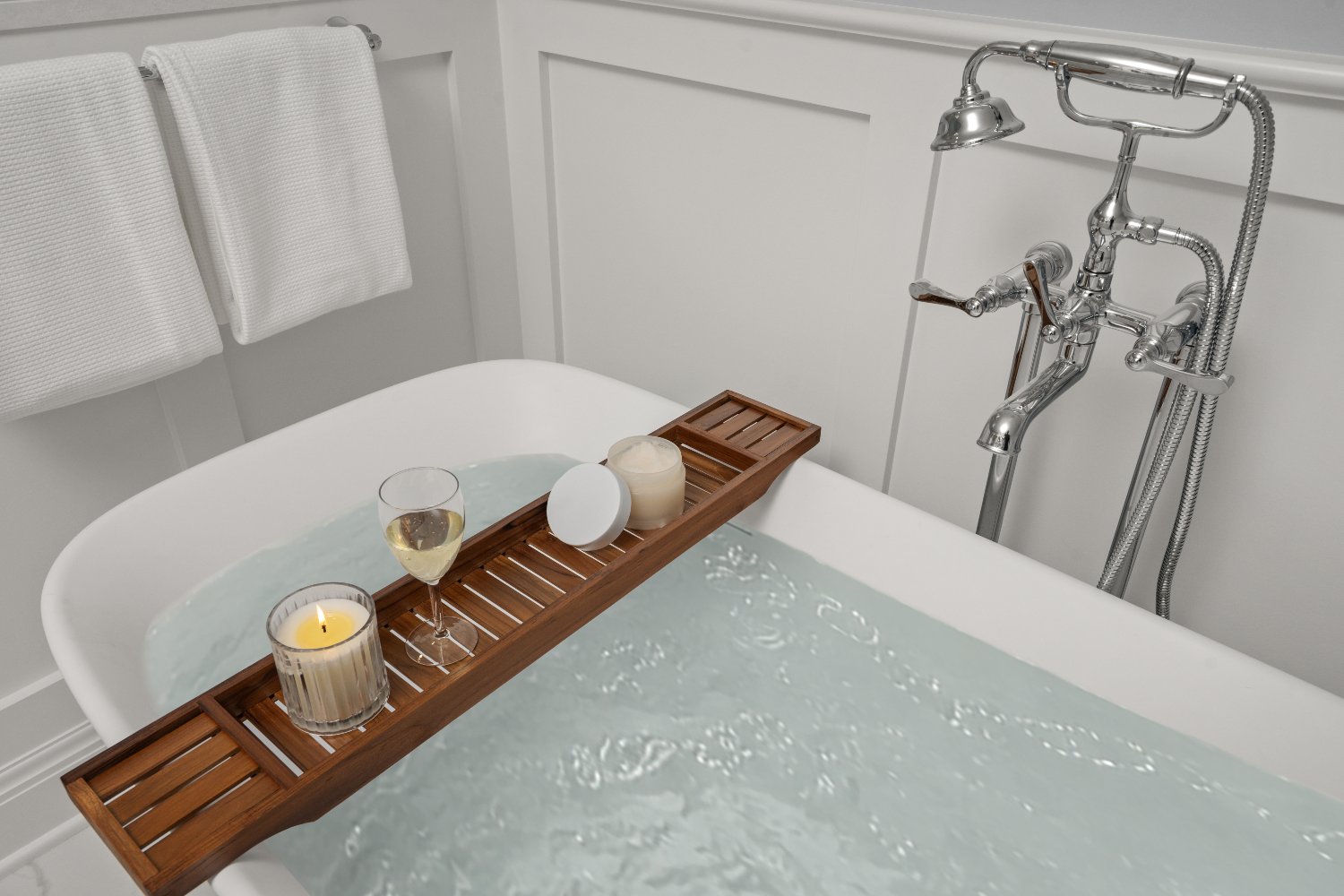Shaker Heights bathroom renovation by Chagrin River Company featuring a soaking tub with polished chrome floor-mounted faucet.-optimized