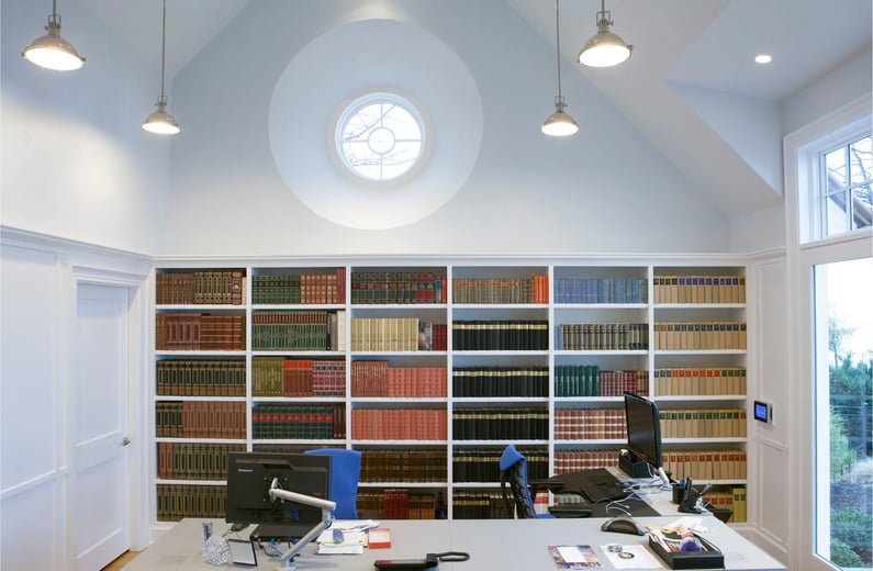 home office remodel with built in bookshelves and white molding on walls