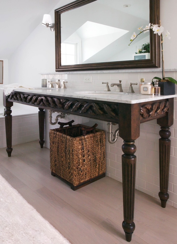 luxury bathroom remodel with double vanity and carved wood details by Chagrin River Company in Shaker Heights, OH