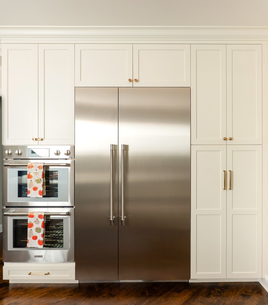 kitchen remodel with dual stainless steel refrigerators and white cabinetry by Chagrin River Company in Shaker Heights, OH