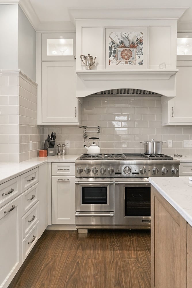 kitchen remodel with stainless steel range and white cabinetry by Chagrin River Company in Shaker Heights, OH
