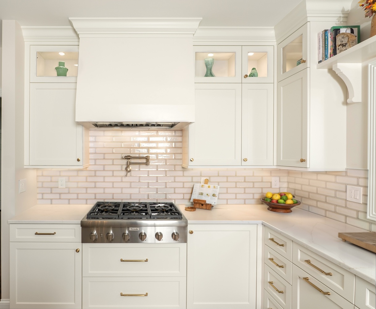 white kitchen remodel with subway tile backsplash and pot filler faucet by Chagrin River Company in Shaker Heights, OH