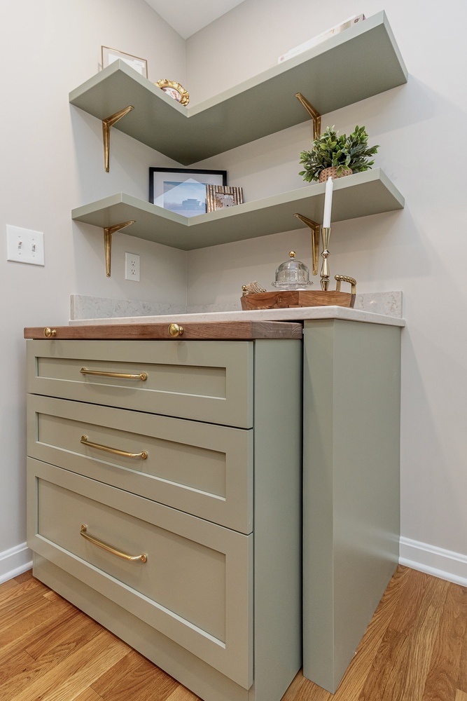 Shaker Heights, OH custom home kitchen built by Chagrin River Company featuring butcher block counter and floating shelves.