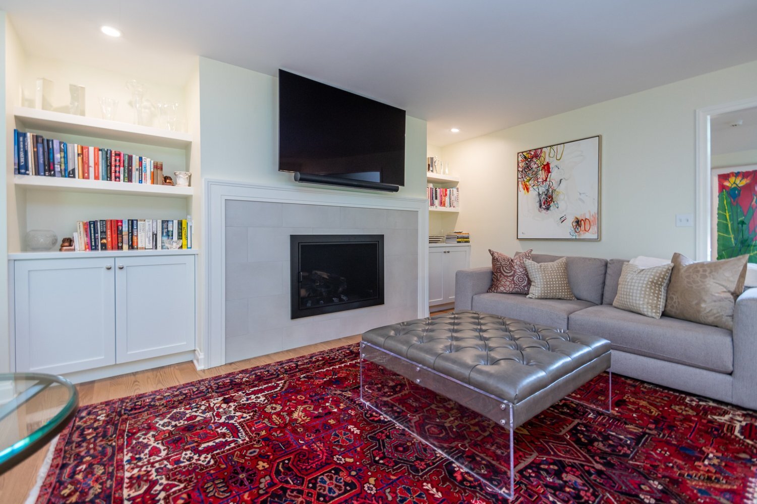 Pepper Pike, OH custom home living space built by Chagrin River Company with contemporary seating and built-in cabinetry.