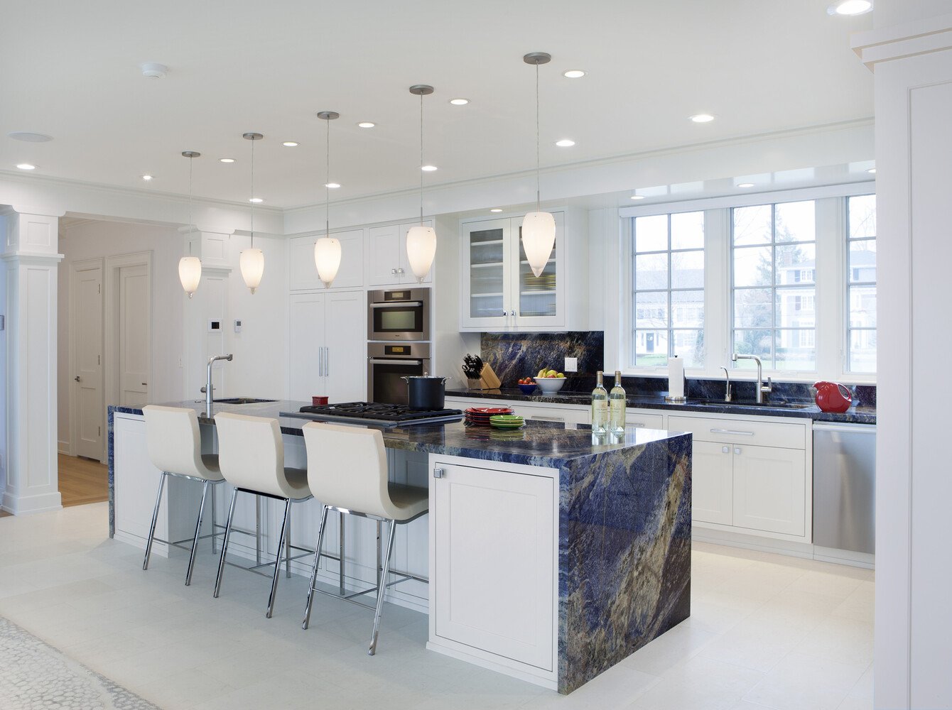 custom home white kitchen with blue granite island by Chagrin River Company in Chardon, Ohio
